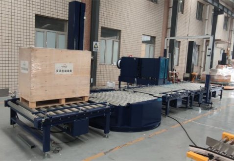 Paper-roll pallet online strapping and wrapping line